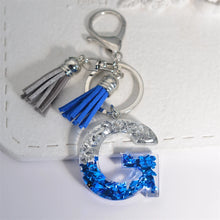 Llaveros creativos de resina de 26 letras con borla, accesorios de moda con iniciales, lentejuelas, color azul y plateado, colgante para bolso